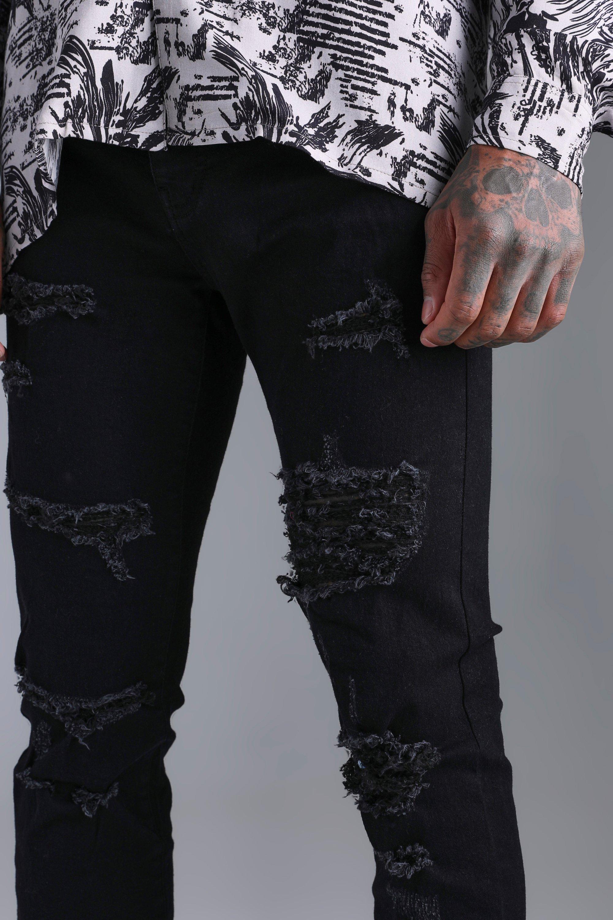 Black jeans with store lots of rips